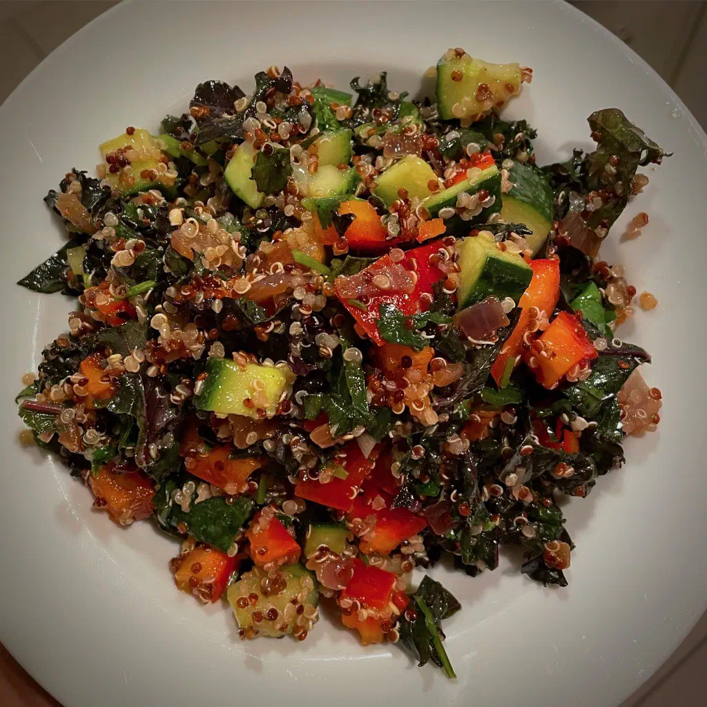 Plated warm quinoa and kale salad